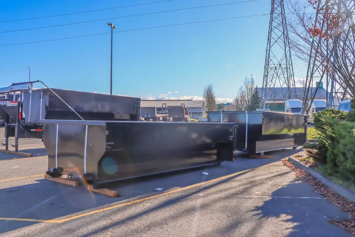 Roll-off dumpster ready for waste disposal at job site for Concrete Dumpster Rental in Mount Morris
